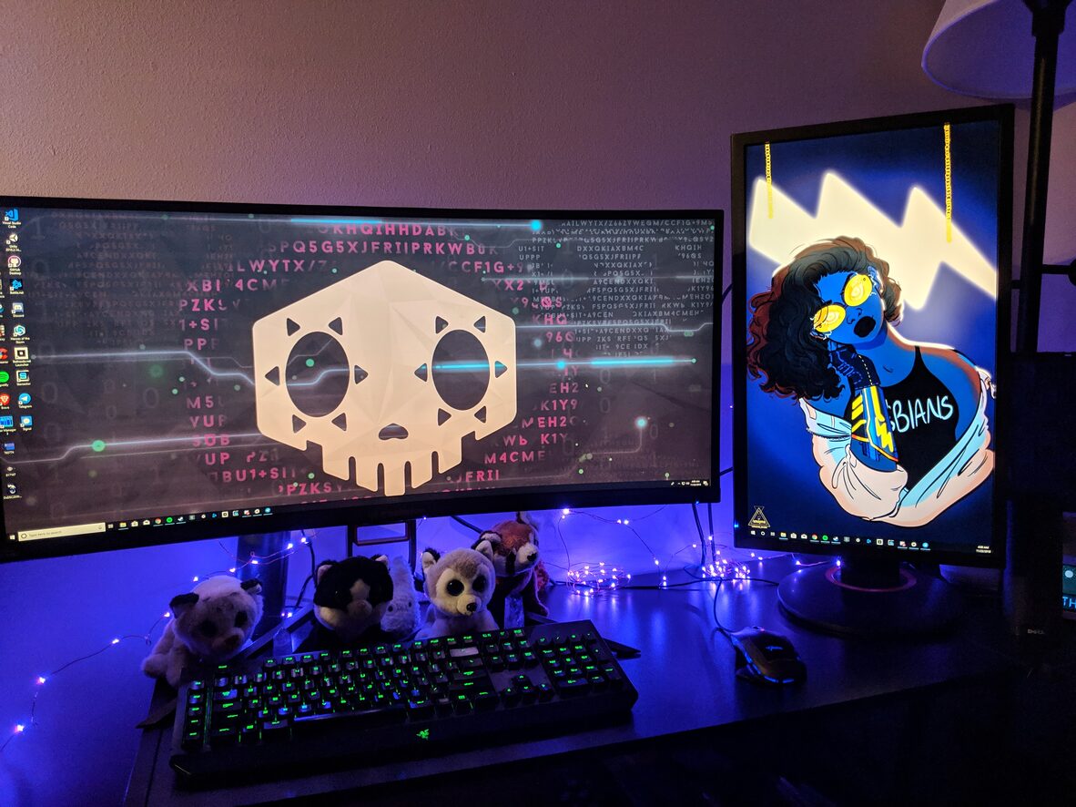 A colorful two-monitor desk setup
