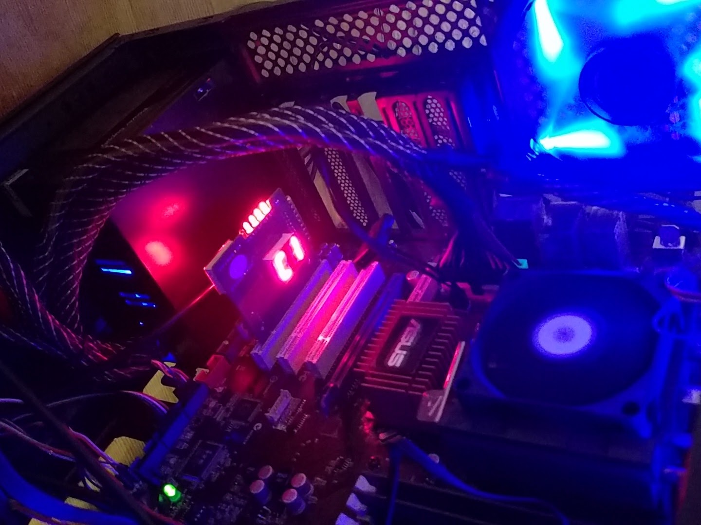 The blue and purple lit interior of a desktop computer tower